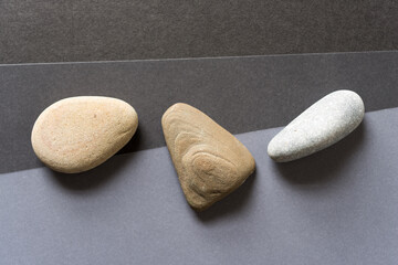 stones on gray paper