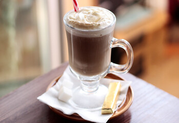 glass of cappuccino with shugar breakfast morning