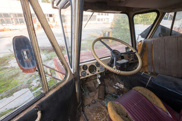 Cabin of abandoned radioactive vehicle, old rusty truck near ghost town Pripyat