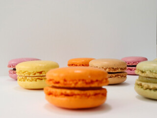 colorful macaroons on wooden table