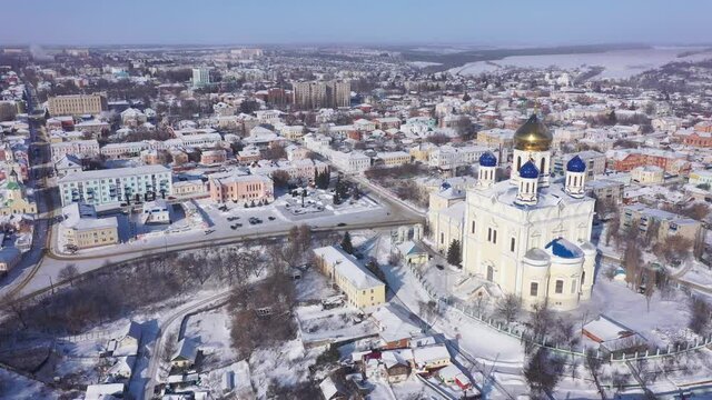Aerial view of the Ascension Cathedral, located in the historical center of the city on the Red Square of Yelets, and the surrounding his residential areas in winter, Russia.