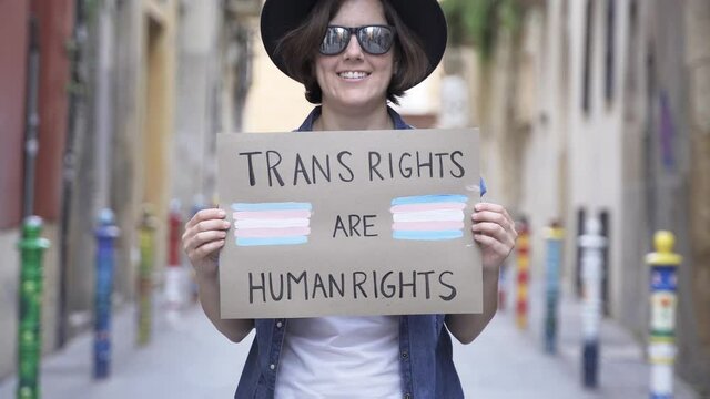 Trans hipster woman at gay pride holding transgender flag banner - Lgbt celebration event concept