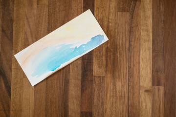 Watercolor on wooden background