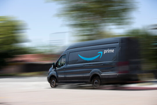Anaheim, California, USA -June 24, 2021: An Amazon delivery truck drives down a street.