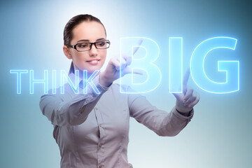 Think big concept with businesswoman