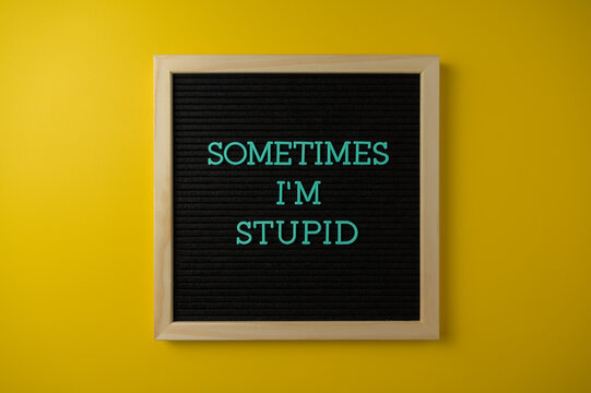Sometimes I'm Stupid Sign on Yellow Background