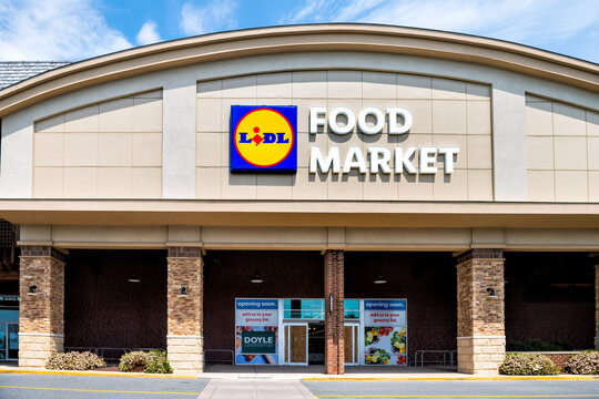 Charlottesville, USA - April 29, 2021: Virginia college city with sign for new Lidl food market store shop European grocery chain coming opening soon