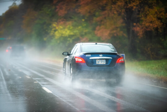 Charlottesville, USA - October 25, 2020: Nissan Maxima Car On Highway Road Traffic During Heavy Rain In Autumn Fall Season In Virginia With Dangerous Slippery Road