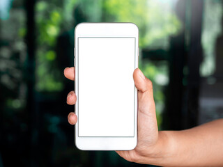 Mockup image of phone. Close-up white blank screen on mobile phone in hand. Hand holding white smartphone with empty screen.