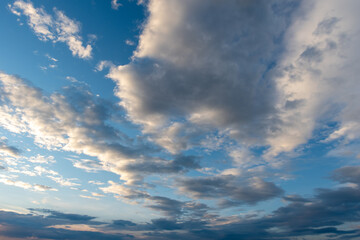 Dramatic sky with stormy clouds. Blue sky with fluffy white clouds. Perfect natural sky background, wallpaper, greeting card