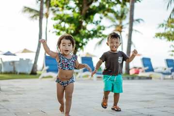 healthy cute asian fun toddler enjoy playing outside together running with friend