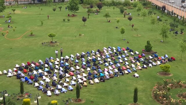 Islamic muslims Group of People are praying namaz Islamic way of prayers nimaz in social distancing during corona-virus in India
