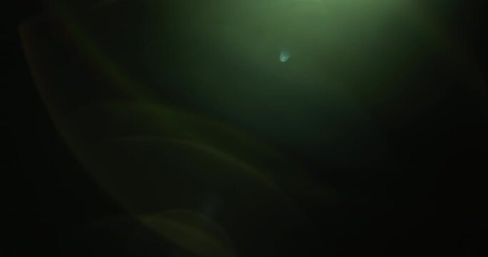Pack of 4 green lens flares overlays for background. Slow motion. 