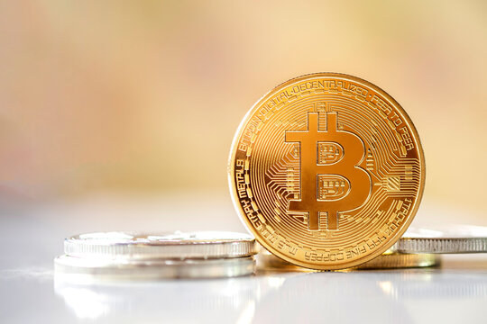 Bitcoin standing in front on bright blurred background, New concept cryptocurrency virtual money is the future of digital currency online financial payments, free copy text space.