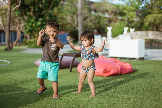 Healthy Cute Asian Fun Toddler Enjoy Dancing Outside Together