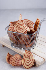 Kue kering or kukis Kuping Gajah is one of Indonesian traditional cookies. Has a unique shape like an elephant ear. The tastes are sweet, delicious and crunchy.