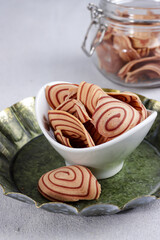 Kue kering or kukis Kuping Gajah is one of Indonesian traditional cookies. Has a unique shape like an elephant ear. The tastes are sweet, delicious and crunchy.