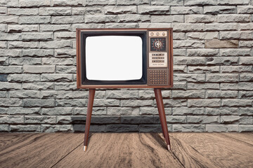 Retro old TV set receiver front rock wall background.