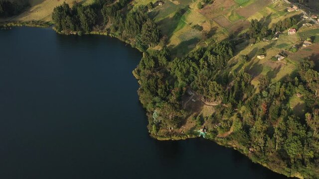Aerial View, Laguna de Tota, Boyaca, Colombia. Coast of Natural Lake, Landscape of Andean Highlands on Sunny Day, Drone Shot