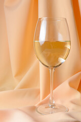 Wine collection - White wine in glass over golden background.