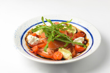 Tomato and salmon salad with cheese and spices. Traditional Italian cuisine, Italian concept.