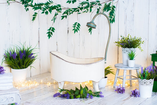 photo zone for shooting a baby. bath, lavender, towels. for one year old baby photo session. cute light background