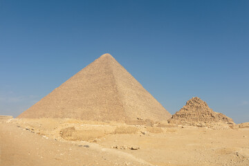Big light pyramid in mysterious Egypt with the blue sky on the background.