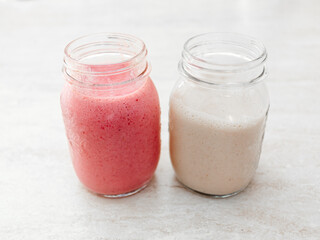 Two strawberries and bananas. Vegan recipe. Summer juice