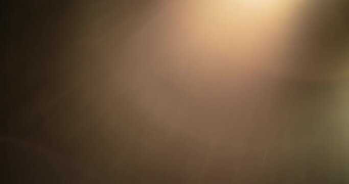 The sun shining through camera lens, creating beautiful light leaks. 4K pack in slow motion.