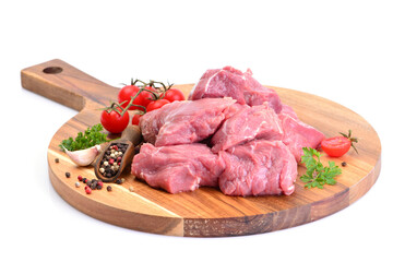 Beef meat with spices and vegetables on a white background