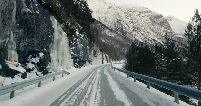 POV Of A Driver Driving On Tunnel Road Revealing Snowy Mountain Near Eresfjord In Norway.