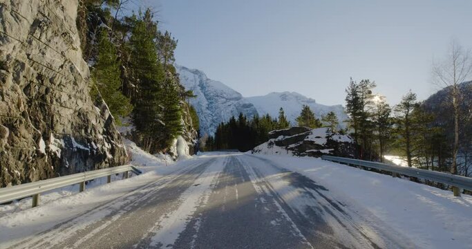 Driving At Mountain Road Tunnel Reveal Scenic Winter Landscape On A Sunny Day In Norway.