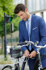 portrait of a successful businessman with bicycle