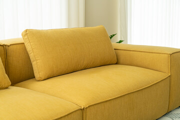 empty yellow fabric sofa in living room