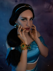 Obraz premium Beautiful princess closeup on the night sky background. Art photo.Jasmine princess cosplay. 