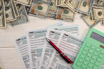 1040 individual form, with us money.  Tax time concept
