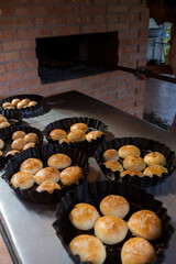 Fresh homemade bread taken from the wood oven. Close up of rustic whole meal bread rolls