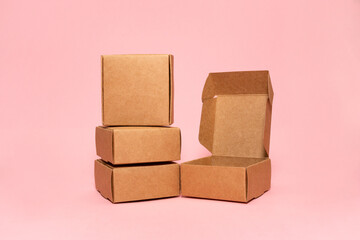 Self-gathering cardboard box. Delivery, moving, gift wrapping on a colored background. Place for text and logo. Brown.