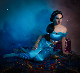 Beautiful princess closeup with magic lamp in her hands. Art photo.Jasmine princess cosplay.
