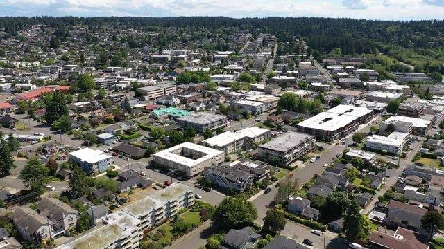 Cinematic 4K drone dolly push clip of the downtown Edmonds commercial area, near Seattle in Western Washington, Pacific Northwest, in Snohomish County