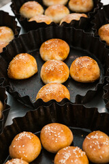 Fresh homemade bread taken from the wood oven. Close up of rustic whole meal bread rolls