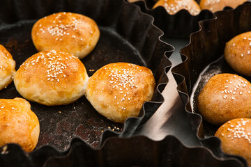Fresh homemade bread taken from the wood oven. Close up of rustic whole meal bread rolls