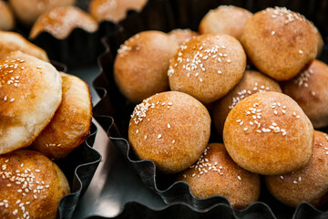 Fresh homemade bread taken from the wood oven. Close up of rustic whole meal bread rolls