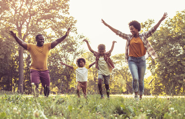 African American family having fun outdoors.
