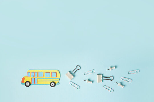 Paper cutting school bus on blue background. Handmade. copyspace