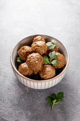  Traditional swedish meatballs in a bowl on gray background vertical photo