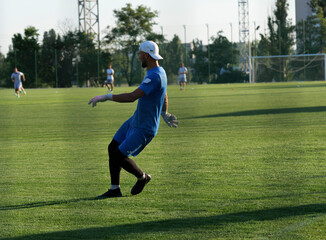 Fototapeta premium horizontal shot young man training on the soccer field