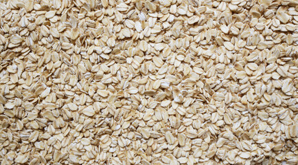 Oatmeal close-up background. Texture of grain superfoods good for health and beauty