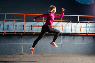 Senior Female Runner During Running Training in Evening City Environment.