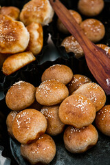 Fresh homemade bread taken from the wood oven. Close up of rustic whole meal bread rolls